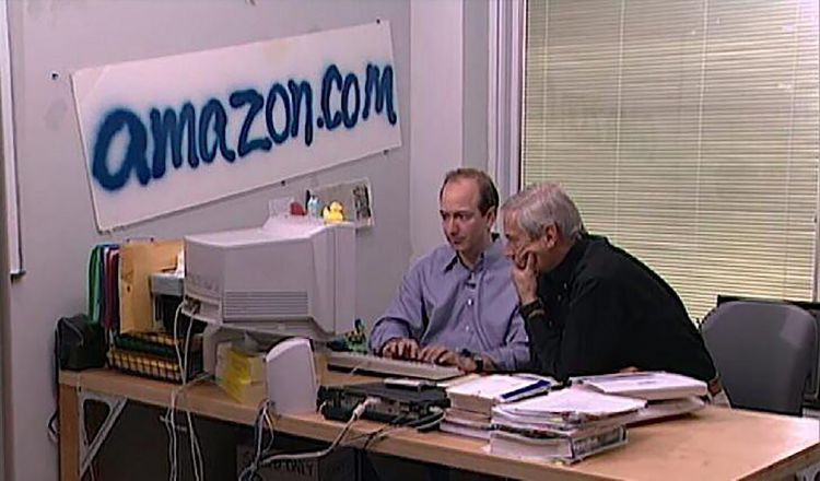 Amazon’s early office in Seattle area with founder Jeff Bezos in the workspace